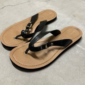 Kelly and Katie black flip flops with tan footbed